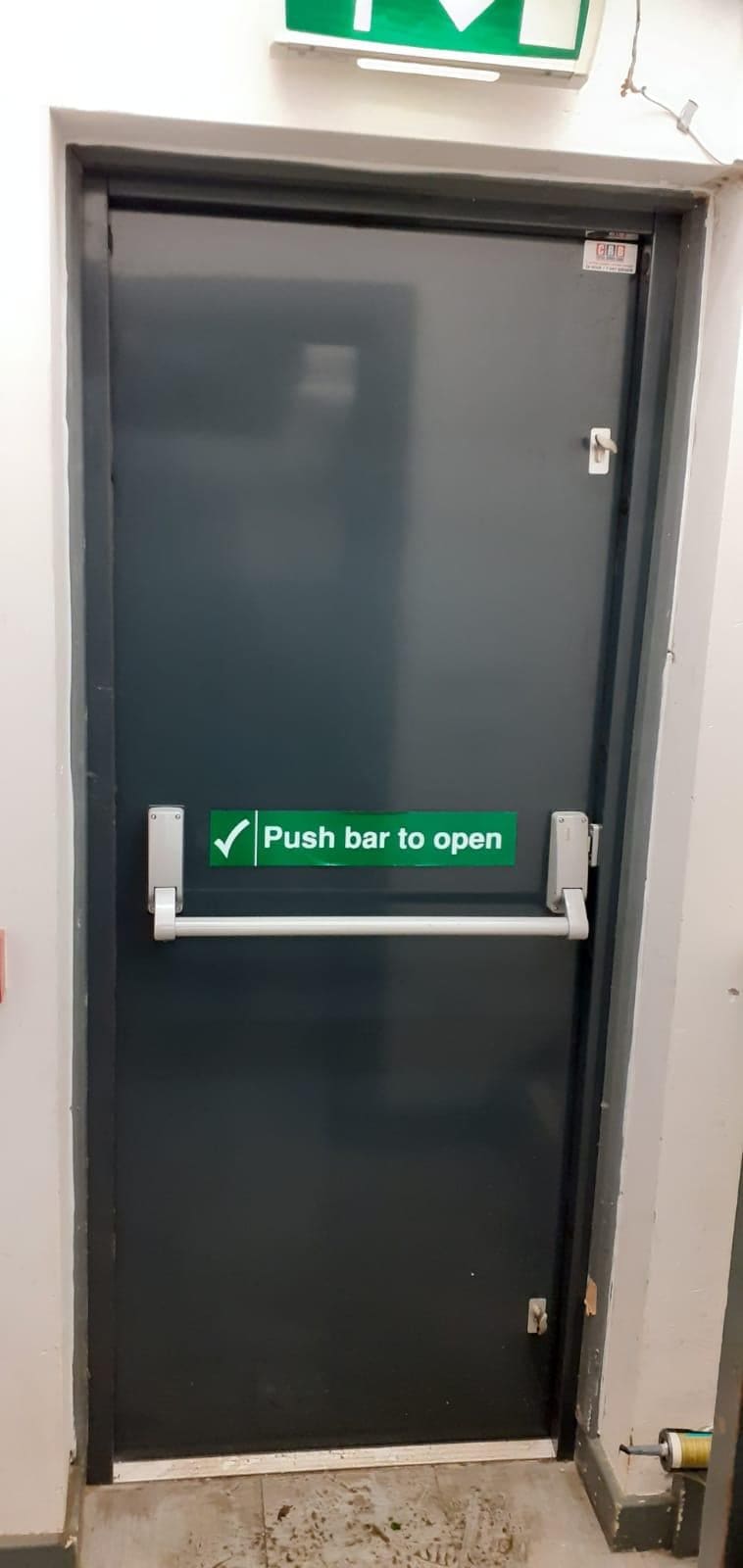 Louvre ventilation steel fire door on industrial unit exterior
